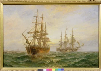 Dos barcos pasando al atardecer